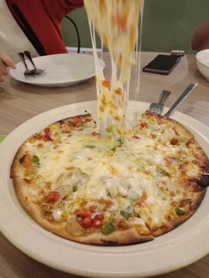 Amazingly stretchy non-dairy cheese on the mushroom pizza. Definitely recommended. at 1st Green Veggie Restaurant in Subang Jaya