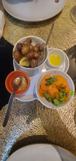 Starter carrots, hummus, olive oil, and olives at Origens in Evora