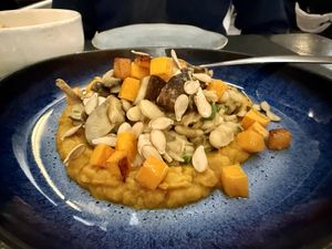 White bean, pumpkin seeds, mixed veggies over pumpkin puree  at Origens in Evora