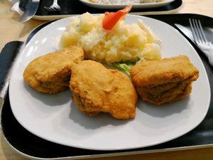 Spinach schnitzels with potato salad at Formosa Food in Vienna