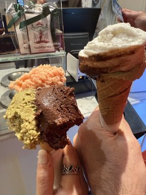 Medium size, you can choose 2 or 3 flavors. I go with pistachio, orange ginger, and dark chocolate. My partner go with pistachio, coco, and dark chocolate. Rich flavor  at Gelato San Lorenzo in Rome