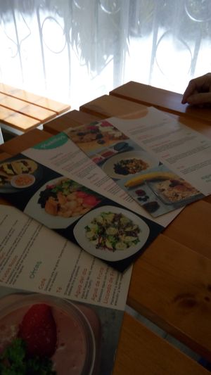 Colorful menus at Kakao Cocina Vegana in La Paz