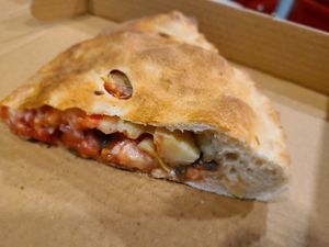 Calzone - tomatoes, artichoke & olives at Troy's Italian Kitchen in Arlington