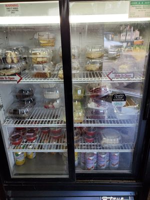 Fridge with vegan cakes and cheesecakes at Troy's Italian Kitchen in Arlington