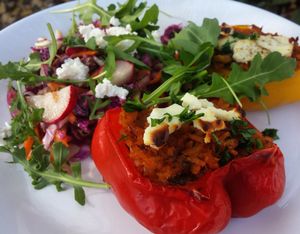 Grilled stuffed paprika with rice and feta on top served with rainbow salad. at Kawiarnia Stol Powszechny in Warsaw