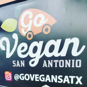 Banner with IG handle at Go Vegan San Antonio in San Antonio