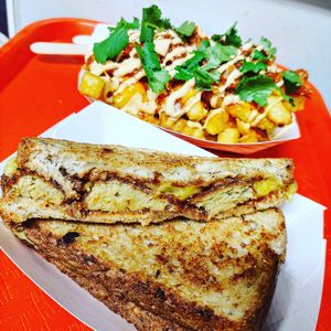 Maple BBQ Chk'n Strip Sammy and loaded Kimchi fries at Go Vegan San Antonio in San Antonio