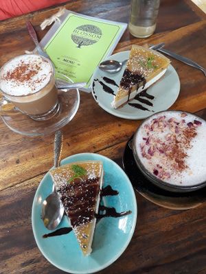 Superfood latte, pink rose latte and passion fruit cheesecake at Blossom Cafe in Pai