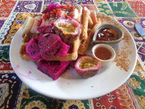 Vegan waffles smothered in fruit! at Blossom Cafe in Pai