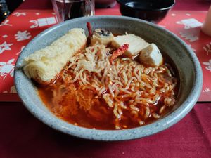 Spicy tangy on the tongue noodles with mock fish balls at Rumah Juliet in Jakarta