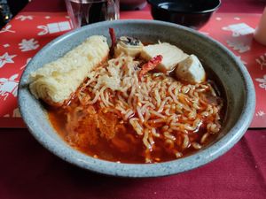 Spicy tangy on the tongue noodles with mock fish balls at Rumah Juliet in Jakarta