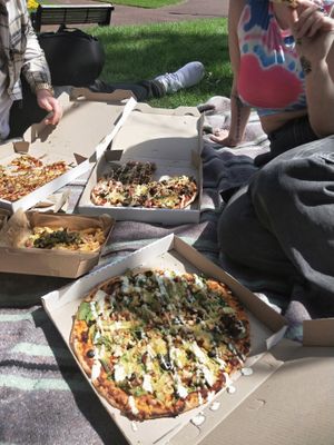 A delicious selection of pizza and loaded fries.  at Gorilla Kitchen in Auckland