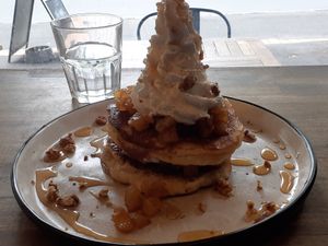 The delightful apple pancakes, with candied walnuts, coconut ice cream  & cream at Gorilla Kitchen in Auckland