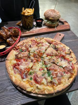 Hawaiian pizza, cauliflower wings, burgers and fries at Gorilla Kitchen in Auckland