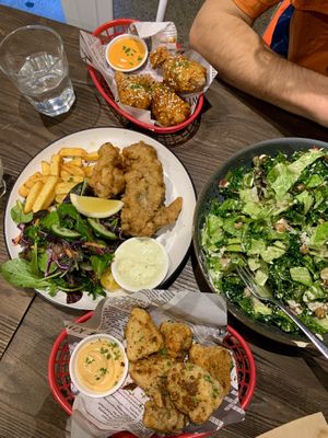 Fish and chips, Asian chicken drumsticks, spicy nashville cauliflower wings, Caesar salad at Gorilla Kitchen in Auckland