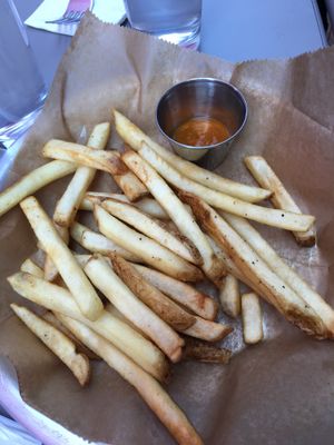 Seasoned fries with curry dipping sauce  at Mello Velo Cafe in Syracuse