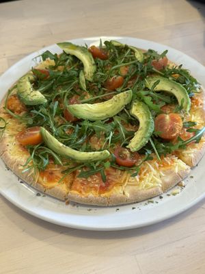 Pizza with avocado (gf option)   at Roots Cafe in Cascais