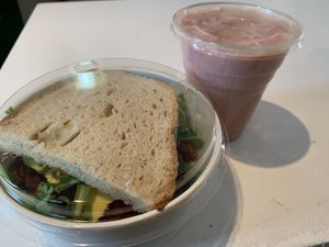 Vegan sandwich and strawberry smoothie at Roots Cafe in Cascais