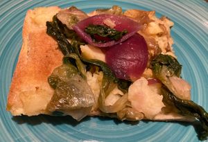Pizza with roasted potatoes, endive, raisins, marinated onions  at Pane e Tempesta in Rome