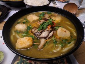 Kare Burosu Ramen [£10.95] – (Vegan) shichimi-coated silken tofu and grilled mushrooms on udon noodles in curried veg broth, topped with pea shoots, carrot, chili, coriander at Wagamama in Guildford