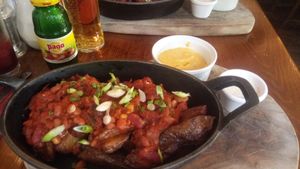 Vegan smokey bean chilli with nacho cheese sauce and cumin almond yoghurt at The Crown and Anchor in Barnsley