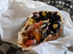 Burrito with black beans and fajita veggies at Amigo Daily Burrito  in Mackinac Island