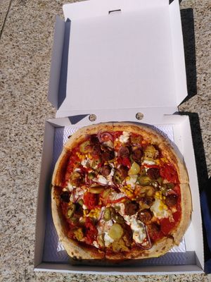 Veggie pizza: vegan sausage, mozarella, jalepinos and misc.   at Pizza Punks in Belfast