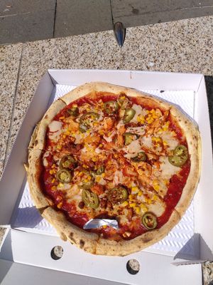 Vegan pizza: vegan mozarella, BBQ base, jalapenos, sweetcorn, spiced Cauliflower, nduja vegan sausage at Pizza Punks in Belfast