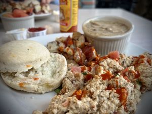 Tofu scramble w/ roasted potatoes, biscuit and vegan gravy    at Beans and Barley Market & Cafe in Milwaukee