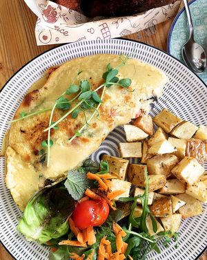 Chickpeas omelette with mushrooms, cherry tomatoes and spinach  at Meraki Market Cafe in Paphos