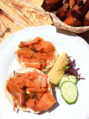 Carrot "salmon" and cream cheese bagel: bagel, marinated carrot, capers, dill, cashew cream cheese, cucumber, lemon,  microgreens at Meraki Market Cafe in Paphos