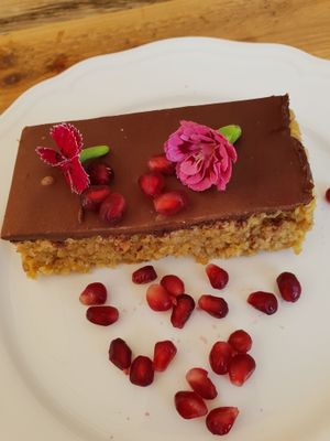 Chocolate flapjack and edible flowers   at Meraki Market Cafe in Paphos