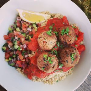 Morrocan vegan meatless balls, couscous, tomato sauce and sclafa 'arobiya. at Meraki Market Cafe in Paphos
