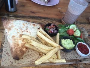 Burrito Samosa (comes with fries, salsa, guacamole, and salad).  at Meraki Market Cafe in Paphos