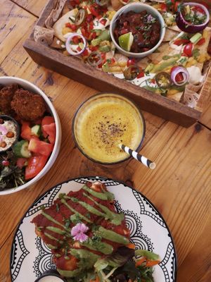 enchiladas, nachos, buddha bowl and iced turmeric latte 🖤 at Meraki Market Cafe in Paphos