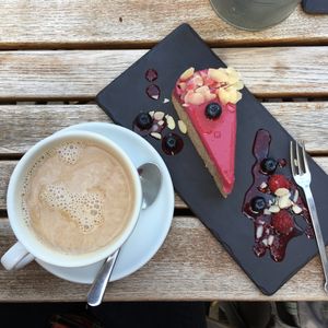 Almond berry cake and coffee with almond milk  at Gelarto Bistro in Budapest