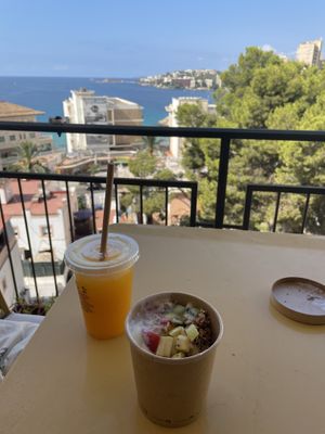 Orange juice + vegan yogurt bowl  at Avocado Mallorca in Mallorca