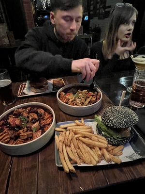 bottom to top - syko burger, festive fries, satay fries, blue christmas burger   at Church - Temple of Fun in Sheffield