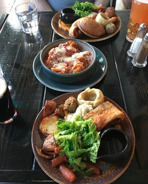 Nearest is the smaller plated roast ('beef' wellington), the furthest is the regular plated roast (spicy veg wellington), and in the middle is a portion of cauliflower cheese. at Church - Temple of Fun in Sheffield