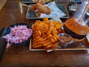 Pickle rib burger, waffle fries, peanut Miso dip, chicken tenders and slaw at Church - Temple of Fun in Sheffield