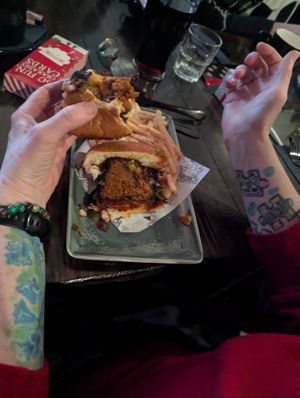 Pickle rib burger - being eaten at Church - Temple of Fun in Sheffield