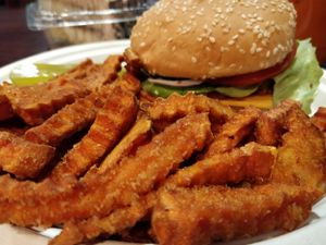 TNK burger with sweet potatoe fries at TNK Vegan Cafe in Modesto