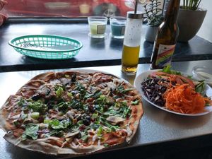 Pitta pizza, salad and homemade dressing at Earth Cafe in Gothenburg