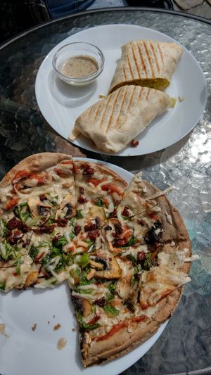 pita bread pizza (vegan) and falafel wrap (vegan) at Earth Cafe in Gothenburg