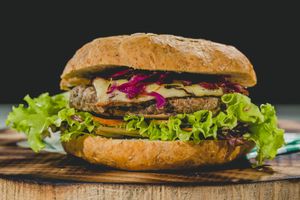 Hamburger with falafel, wholemeal bread, and fresh vegetables. at Green Kitchen in Cartagena