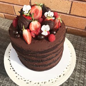 Tall Chocolate Ganache cake with berries at Sugar Baby in Dee Why