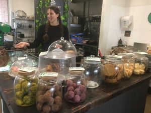 Feast staff cheery in financial exchanges surrounded by fine delicacies at Feast in Geelong