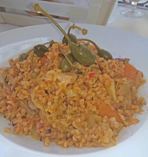 Prassorizo -groats (bulgur) with leeks and cabbage, caper berries and sundried tomatoes at Marilion in Lefkada