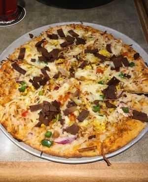 Breggfast Pizza from the weekend brunch menu. Toppings include traditional breakfast items such as hash browns and vegan bacon. at Pizza Luce in St Paul