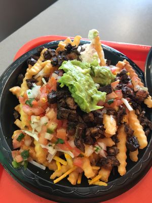 Guapo’s fries topped with vegan carne asada  at Guapo's Taco Shop in Bakersfield